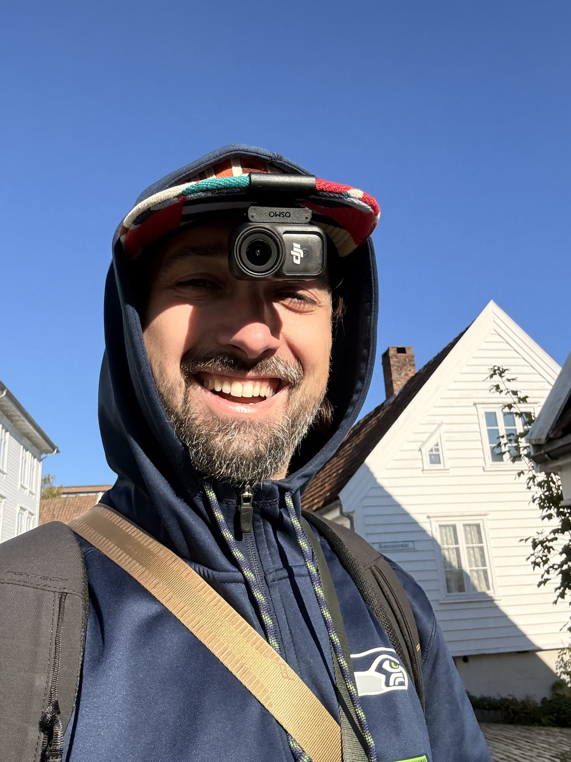 Wedding photographer wearing DJI Osmo Nano on hat mount